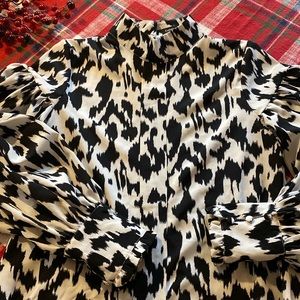 Black and White Animal print. High neck. Puffy sleeves. Covered buttons.